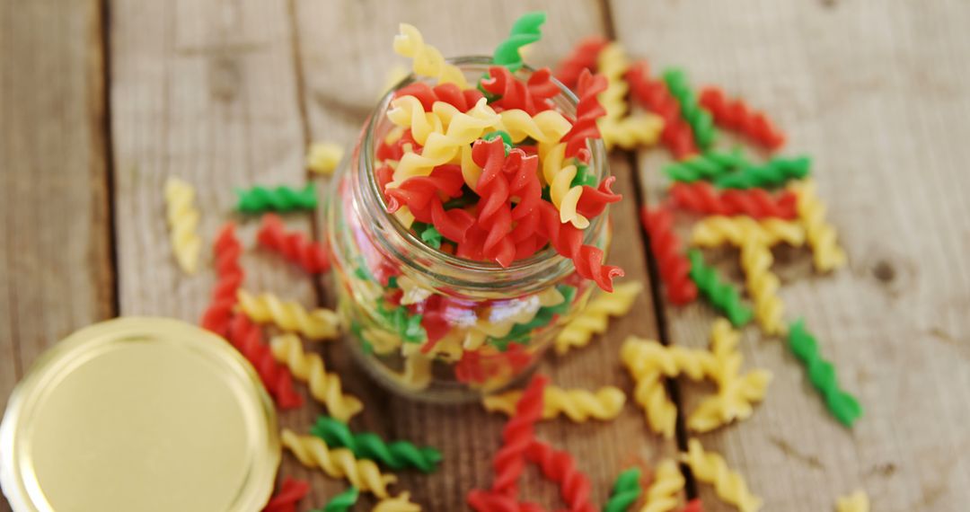 Tricolor Pasta in Glass Jar on Wooden Table - Free Images, Stock Photos and Pictures on Pikwizard.com