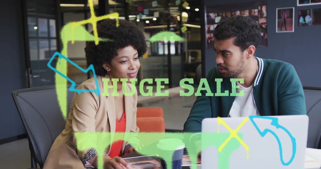 Creative Team Brainstorming Huge Sale Concept in Modern Office