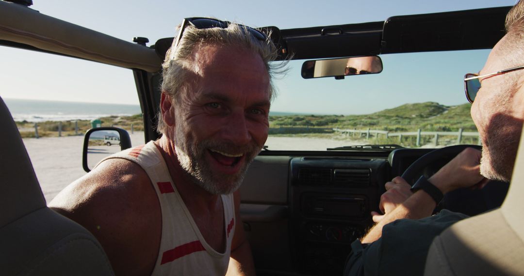 Senior Man Enjoying Convertible Ride by the Beach - Free Images, Stock Photos and Pictures on Pikwizard.com