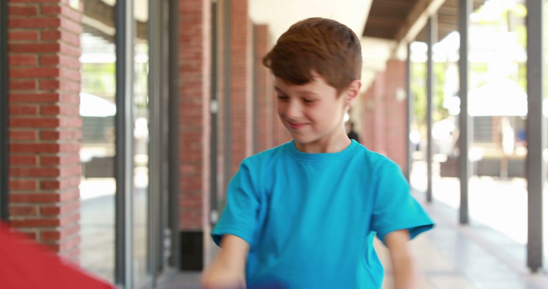 Happy Boy in Blue T-Shirt Playing Outdoors - Free Images, Stock Photos and Pictures on Pikwizard.com