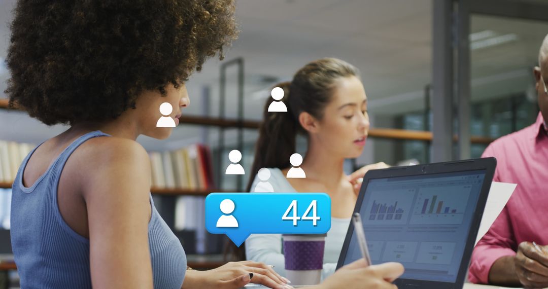 Diverse Team Analyzing Social Media Data on Laptop