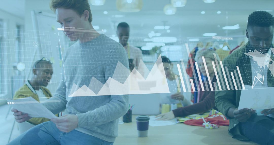 Team Collaborating on Digital Charts in Modern Office