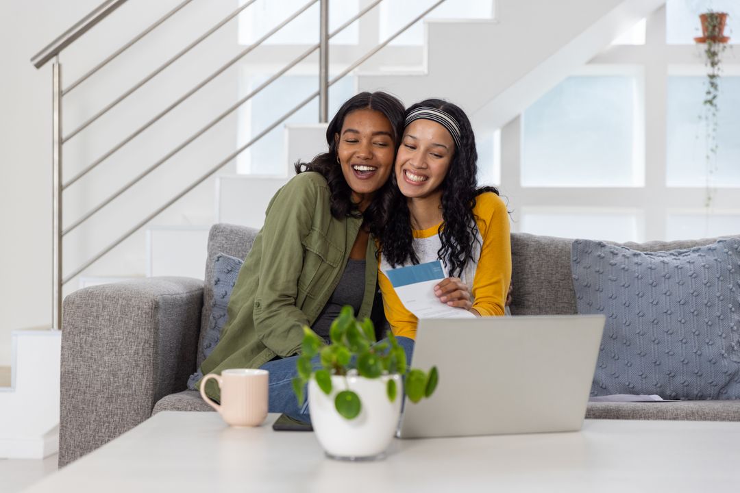 Happy Mother and Daughter Bonding While Reviewing Letter