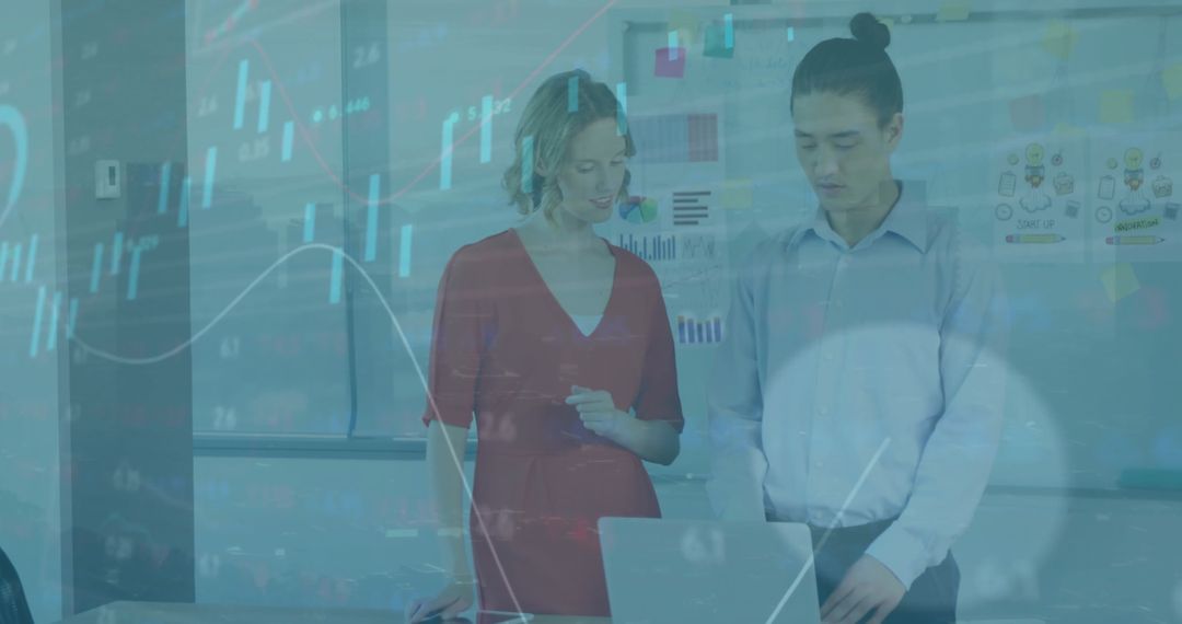 Business Analytics Team Analyzing Financial Data on Laptop