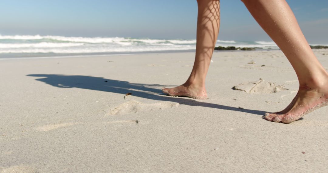 Walking on Sandy Beach by Ocean Waves on Sunny Day - Free Images, Stock Photos and Pictures on Pikwizard.com