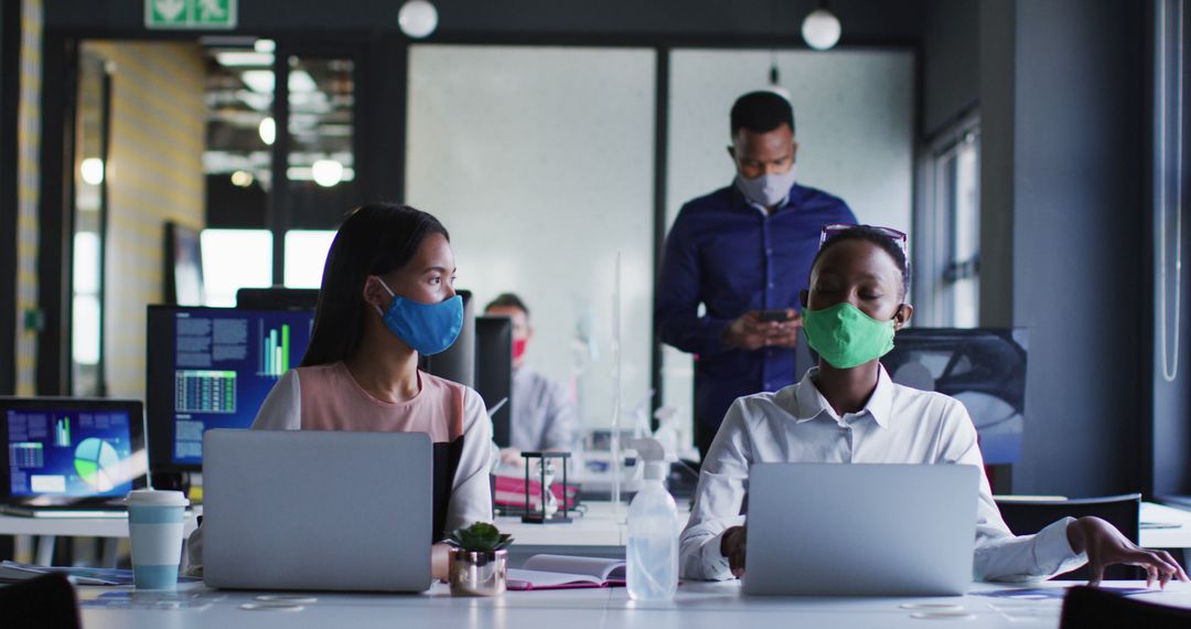 Colleagues Greeting with Elbow Bump in Modern Office