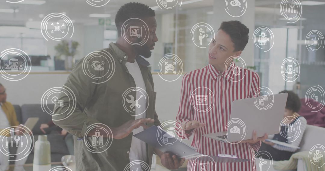 Diverse Colleagues Discussing Digital Technology Strategies in Modern Office