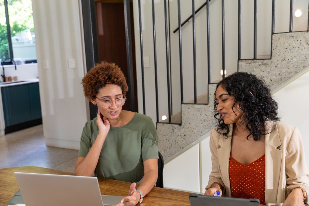 Diverse Coworkers Collaborating in Modern Home Office Setting