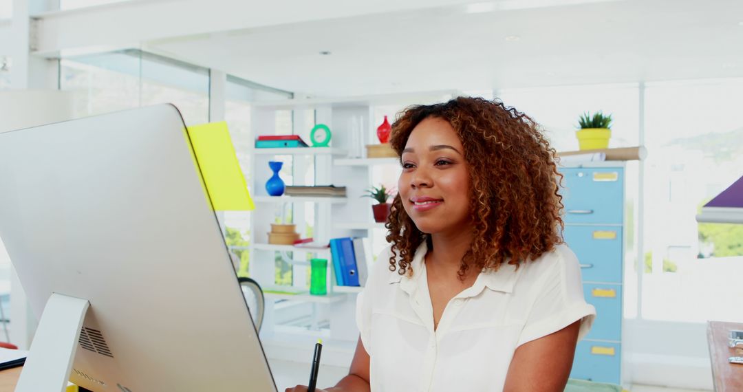 African American Woman Working on Computer in Modern Office - Free Images, Stock Photos and Pictures on Pikwizard.com