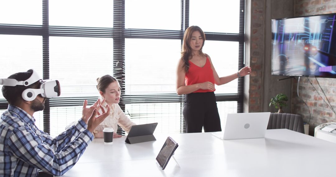 Diverse Team Collaborating with Virtual Reality and Tablet Technology