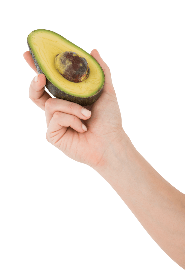 Hand Holding Half Avocado Against Transparent Background