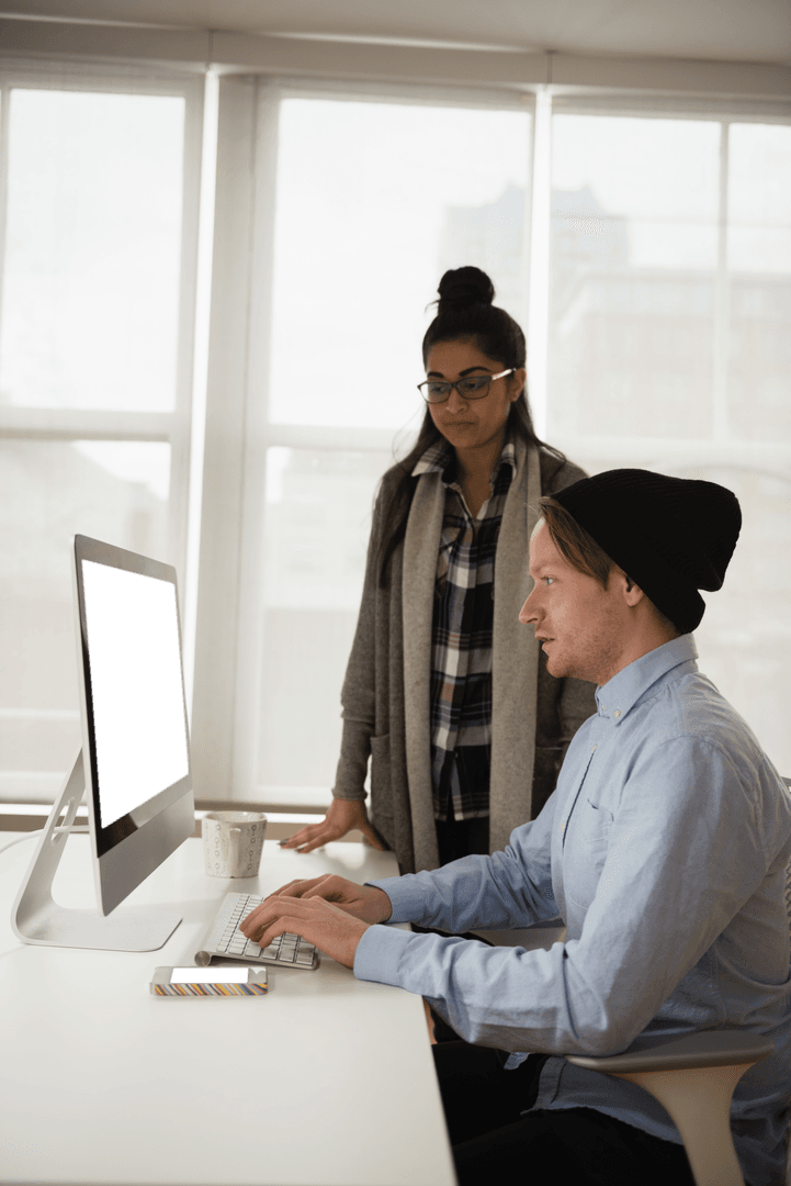 Team Collaboration with Transparent Computer Screen in Modern Office