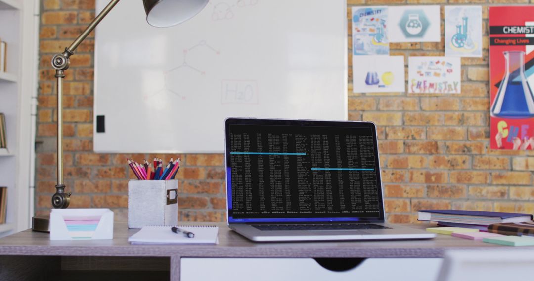 Laptop with Data Analysis Displayed in Modern Office