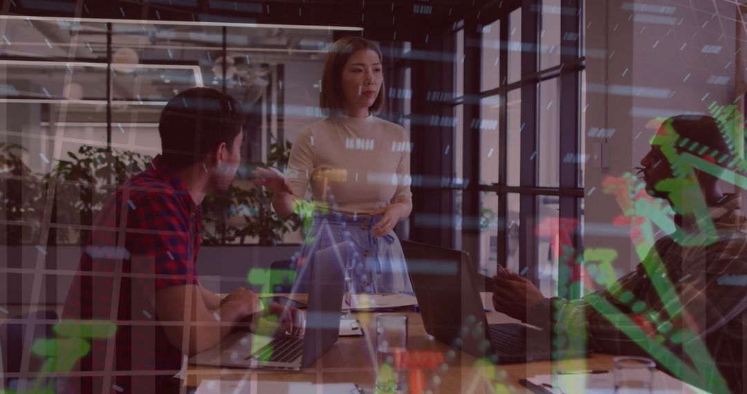 Colleagues Discussing Strategies with Financial Data Overlay