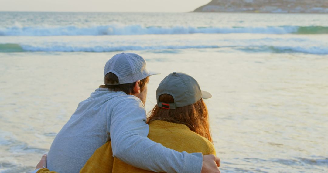 Couple Embracing on Beach at Sunset - Free Images, Stock Photos and Pictures on Pikwizard.com