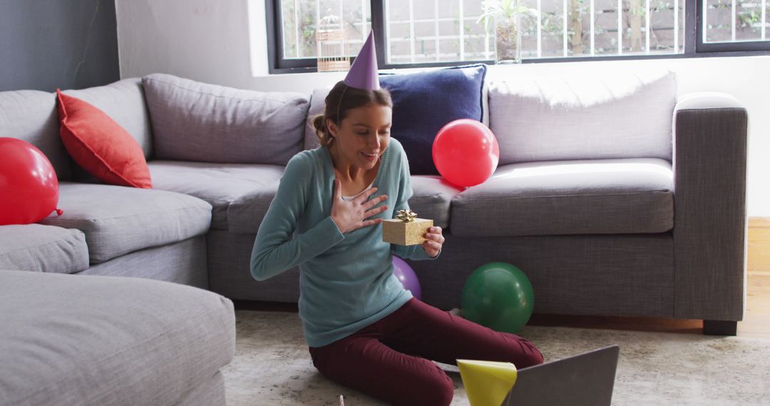 Caucasian Woman Enjoying Virtual Birthday Celebration with Gift - Free Images, Stock Photos and Pictures on Pikwizard.com