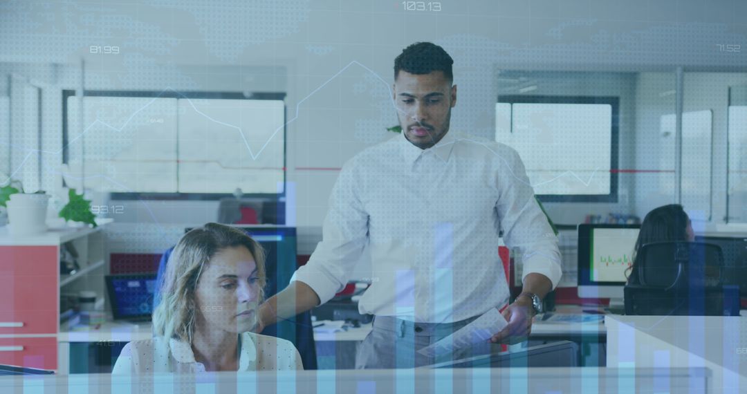 Colleagues Analyzing Statistics on Global Finances in Office