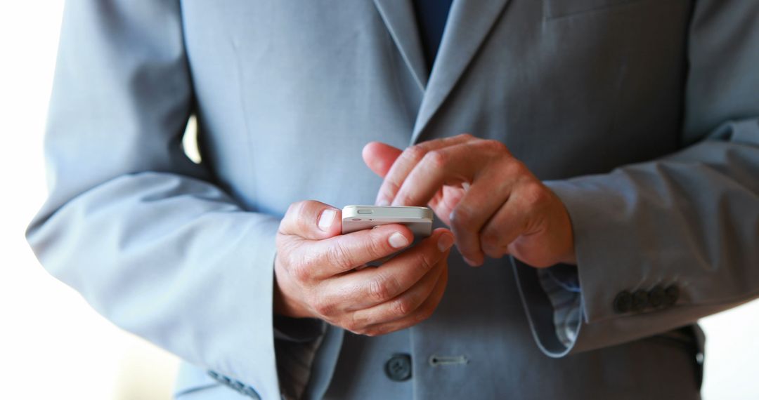 Businessman Texting on Smartphone Close-Up - Free Images, Stock Photos and Pictures on Pikwizard.com