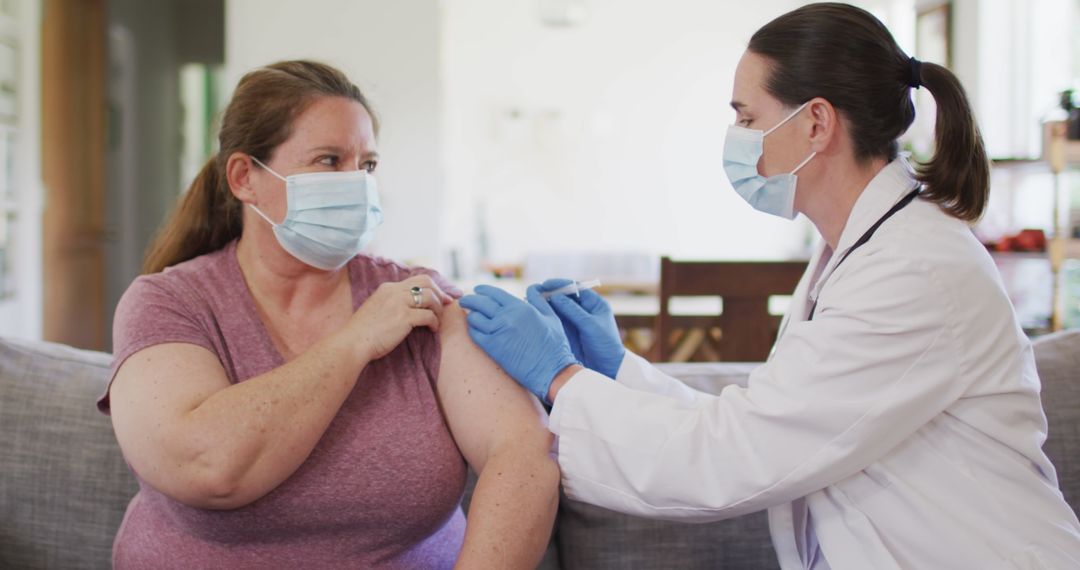 Healthcare Professional Administering Vaccine to Patient at Home