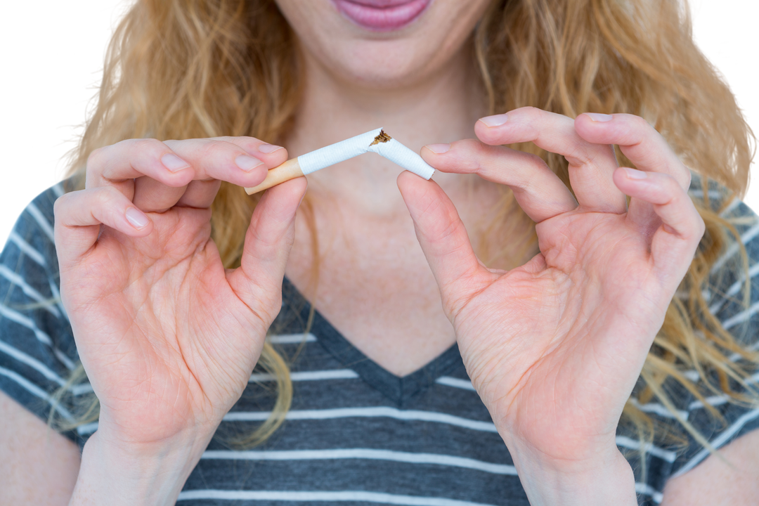 Transparent midsection of blonde woman snapping cigarette - quitting smoking concept - Download Free Stock Images Pikwizard.com