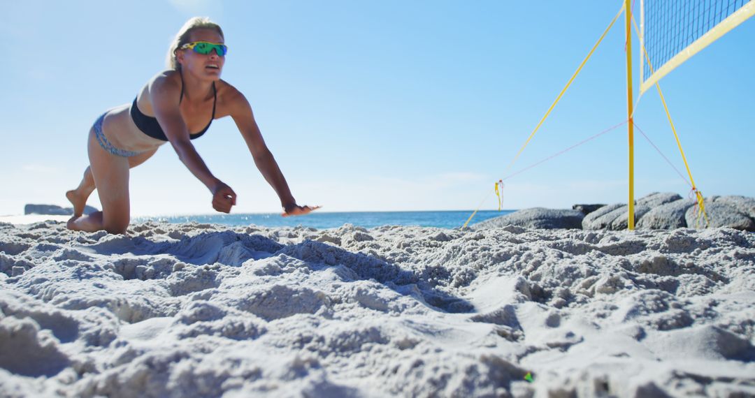 Female Volleyball Player Diving in Sand during Beach Game - Free Images, Stock Photos and Pictures on Pikwizard.com