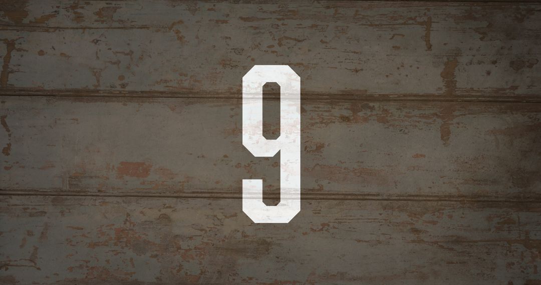 Number Nine on Rustic Background Rust and Rough Plaster