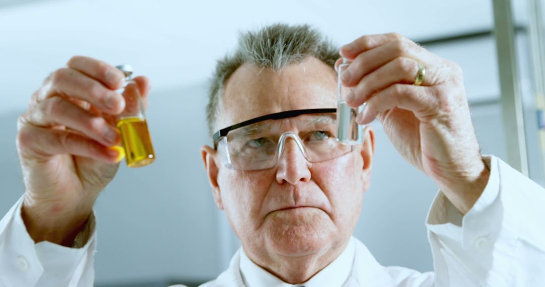 Senior Scientist Analyzing Liquids in Laboratory - Free Images, Stock Photos and Pictures on Pikwizard.com