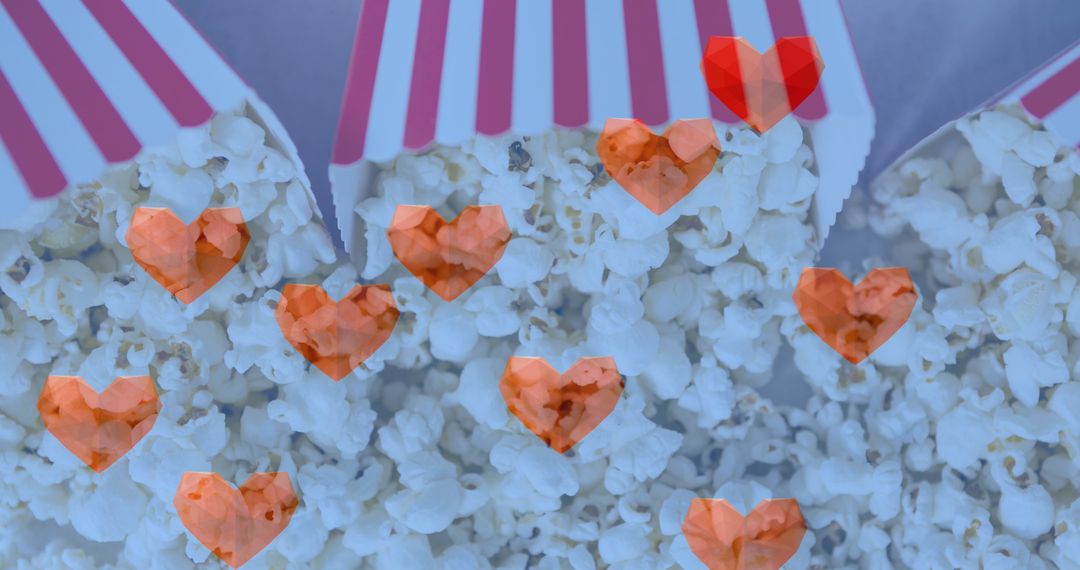 Heart Icons Overlay on Popcorn Boxes for Celebration