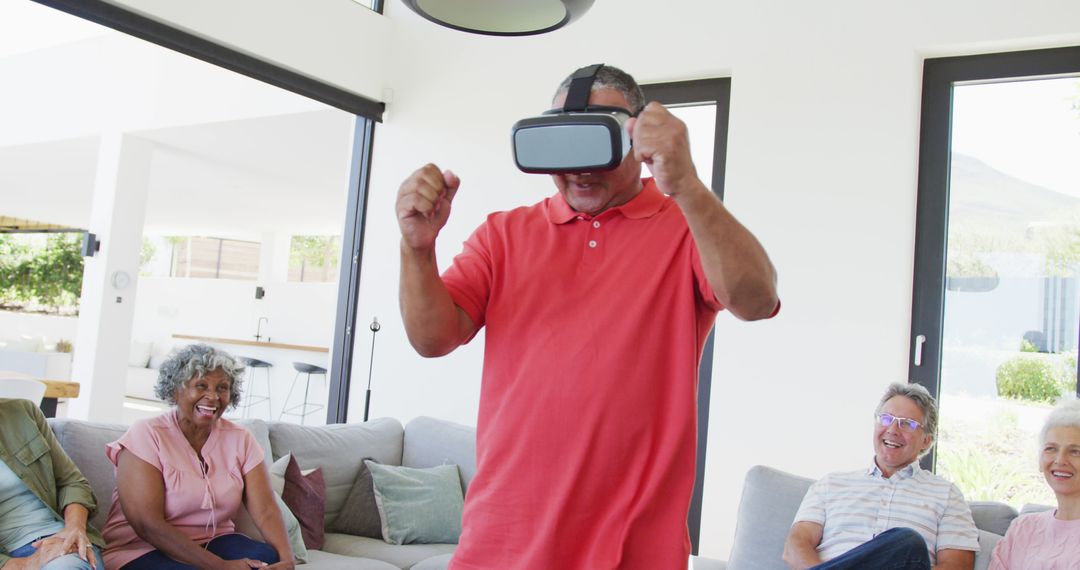 Excited Senior Man Using Virtual Reality Headset with Friends - Free Images, Stock Photos and Pictures on Pikwizard.com