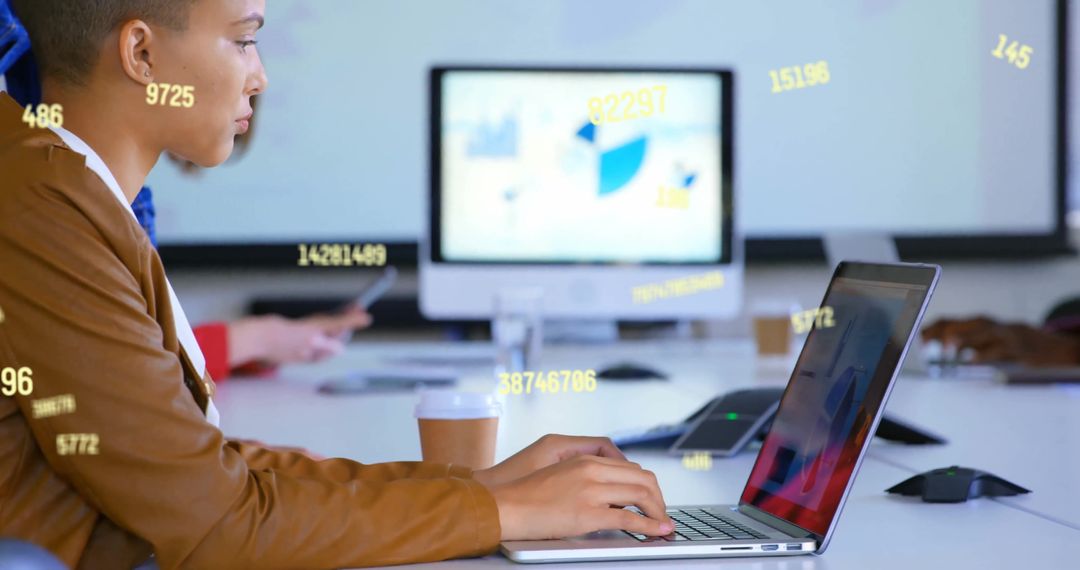 Businesswoman Analyzing Data with Laptop in Modern Office Setting