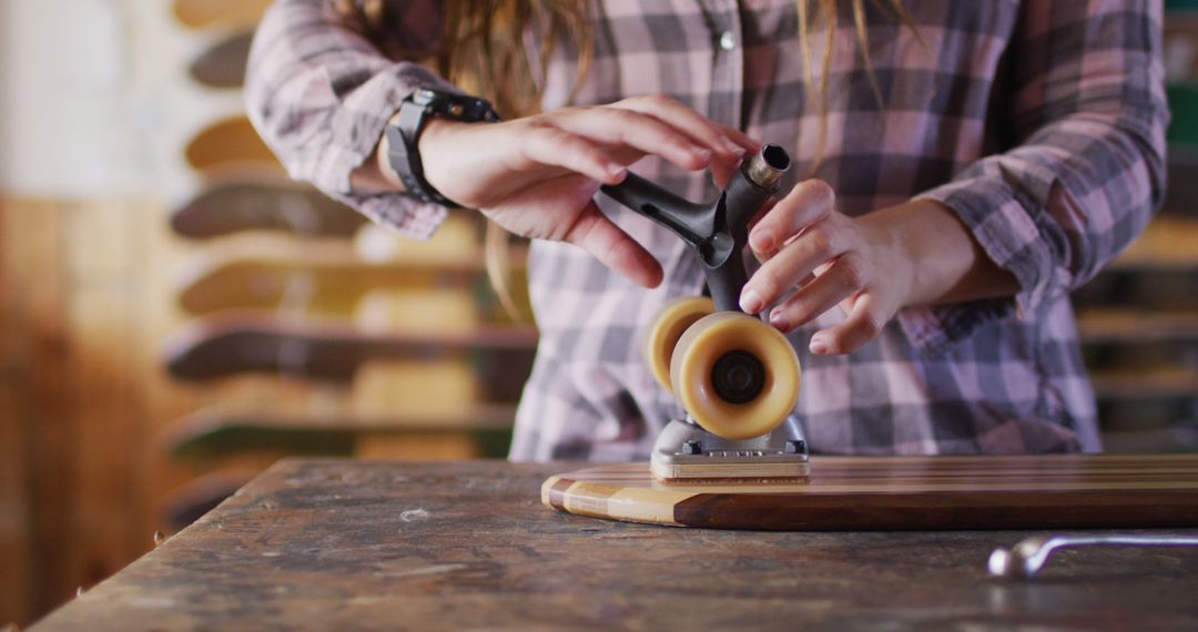 Close-Up of Person Assembling Skateboard with Precision - Free Images, Stock Photos and Pictures on Pikwizard.com