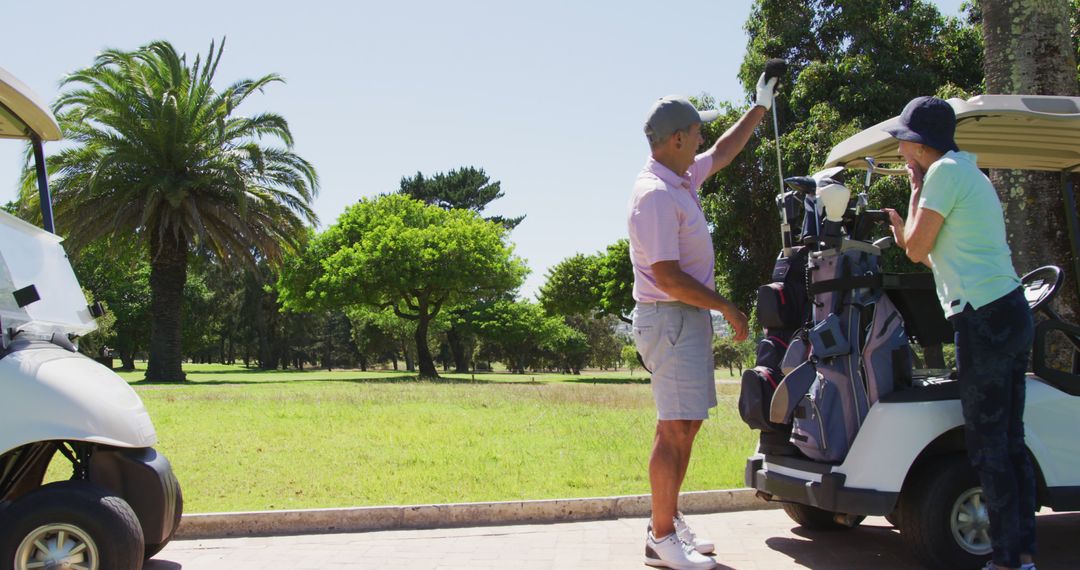 Seniors Enjoying Golf Outing on Sunny Course