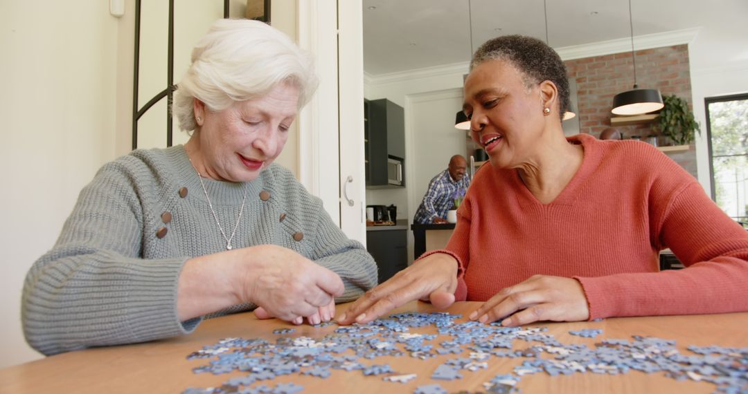 Senior Women Solving Puzzle Together at Home - Free Images, Stock Photos and Pictures on Pikwizard.com