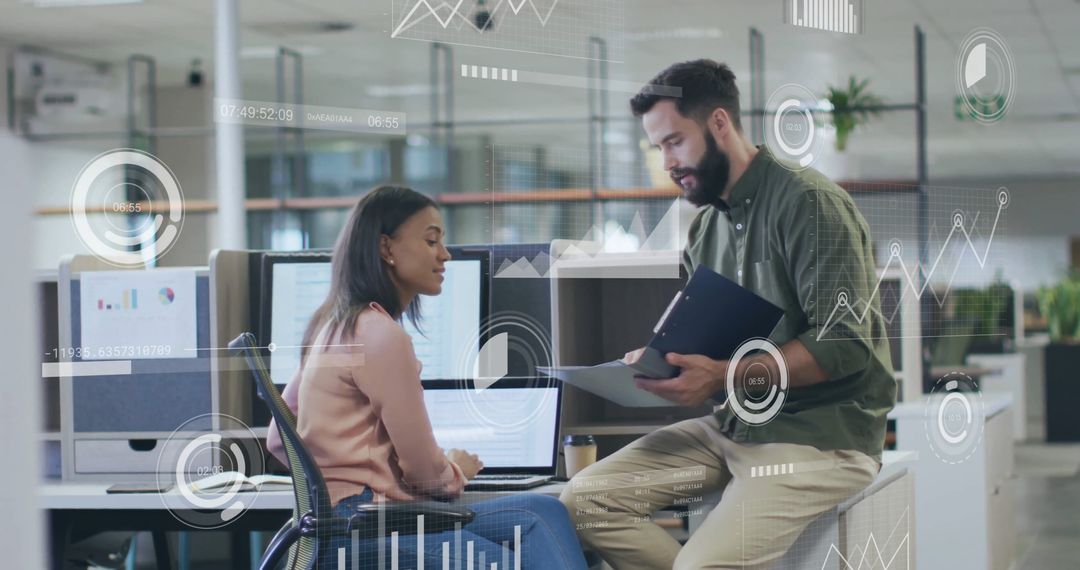 Colleagues Discussing Data Patterns in Modern Office