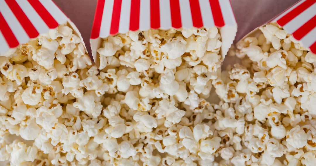 Close-up of Popcorn in Striped Cardboard Containers - Free Images, Stock Photos and Pictures on Pikwizard.com