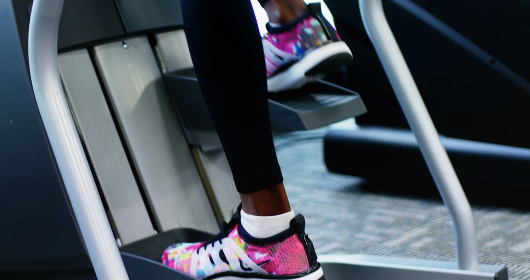 Person Exercising on Stair Stepper Machine in Gym - Free Images, Stock Photos and Pictures on Pikwizard.com