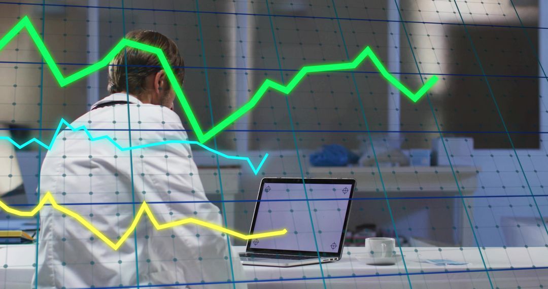 Doctor Analyzing Medical Data on Laptop with Graph Overlays for Healthcare Analytics