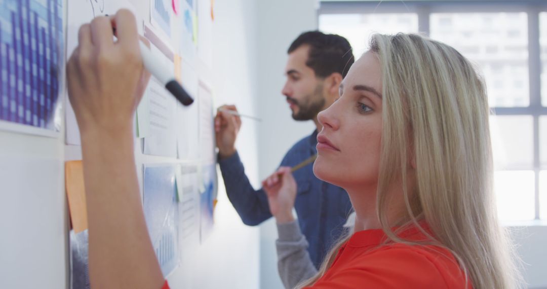 Creative Office Brainstorm with Diverse Team Sharing Ideas