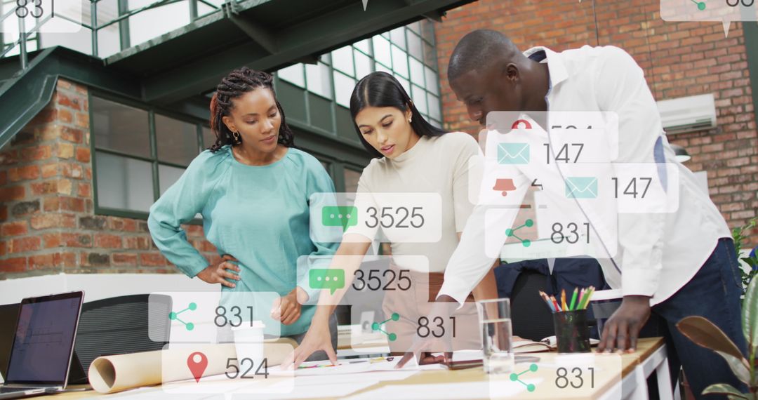 Diverse Team Collaborating Over Office Documents with Social Media Icons