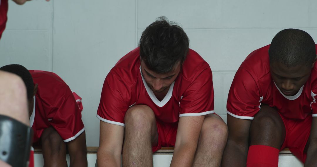 Soccer Players Tying Shoes in Locker Room Before Game - Free Images, Stock Photos and Pictures on Pikwizard.com