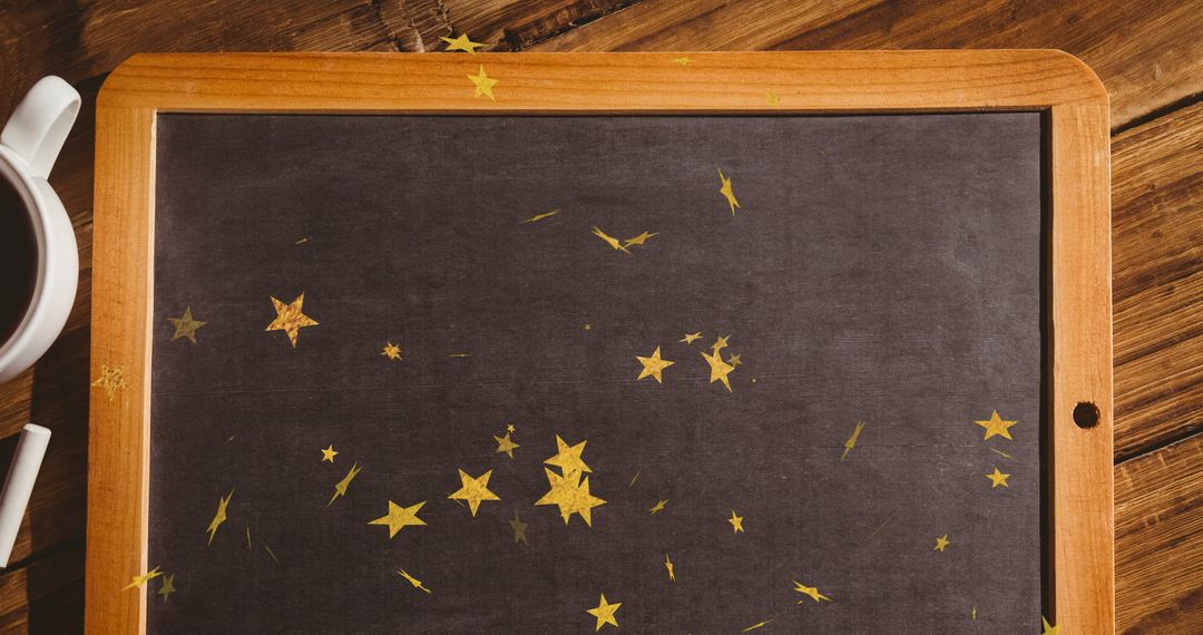 Gold Star Confetti on Rustic Chalkboard with Coffee Cup