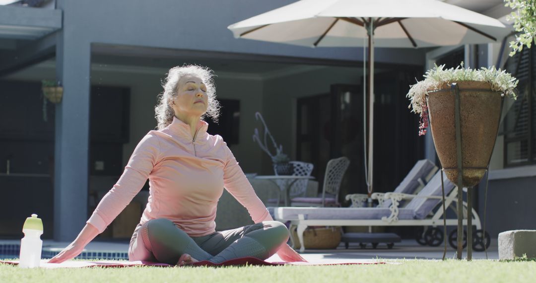 Senior Woman Meditating Outside at Patio on Sunny Day - Free Images, Stock Photos and Pictures on Pikwizard.com