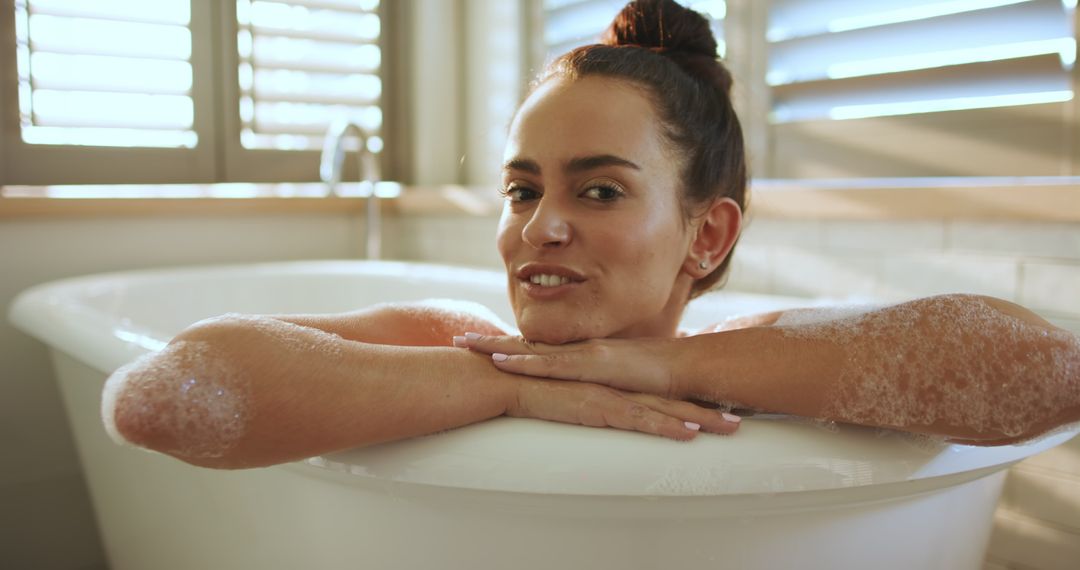 Woman Enjoying Relaxing Bath Time with Soap Bubbles