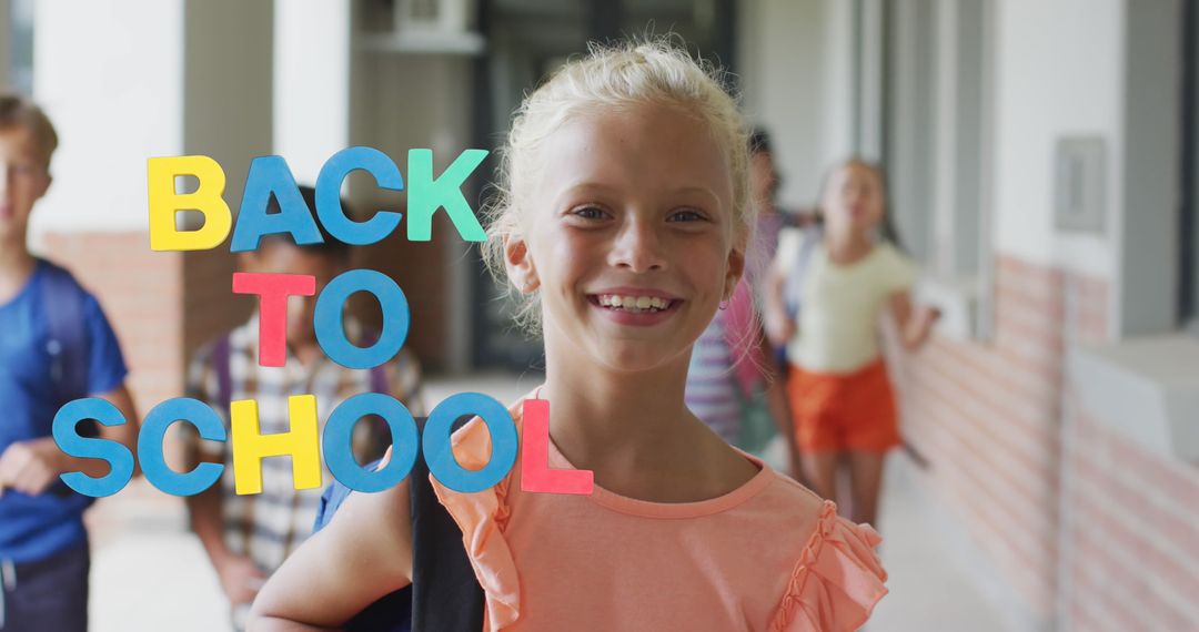 Smiling Schoolgirl Excited for Back to School in Hallway
