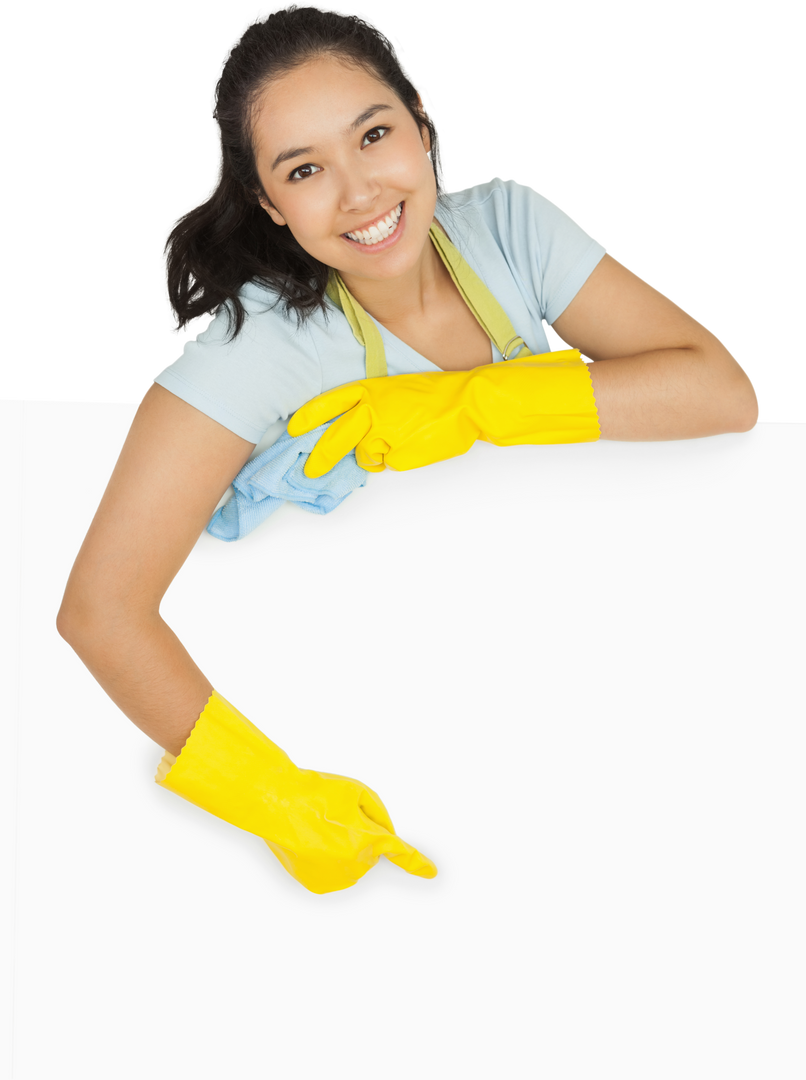 Happy Cleaning Lady in Yellow Rubber Gloves Pointing at Transparent White Surface - Download Free Stock Images Pikwizard.com