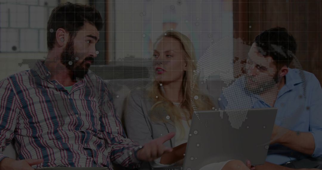 Team Discussing Ideas Indoors with Laptop in Modern Casual Atmosphere