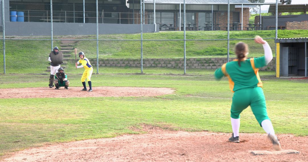 Female Softball Player Pitching in Game Competition