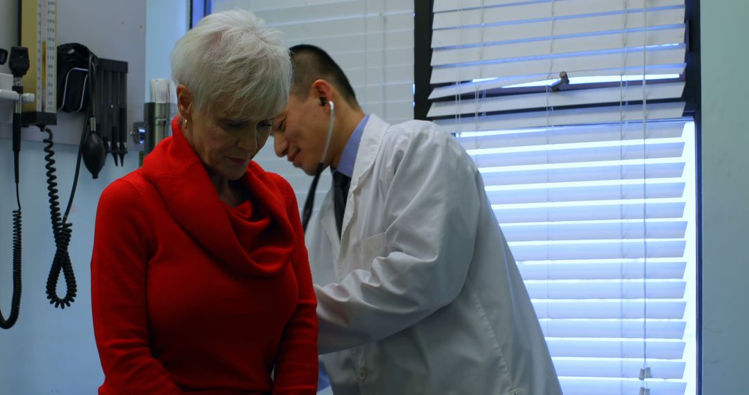 Doctor Examining Elderly Woman In Medical Office - Free Images, Stock Photos and Pictures on Pikwizard.com