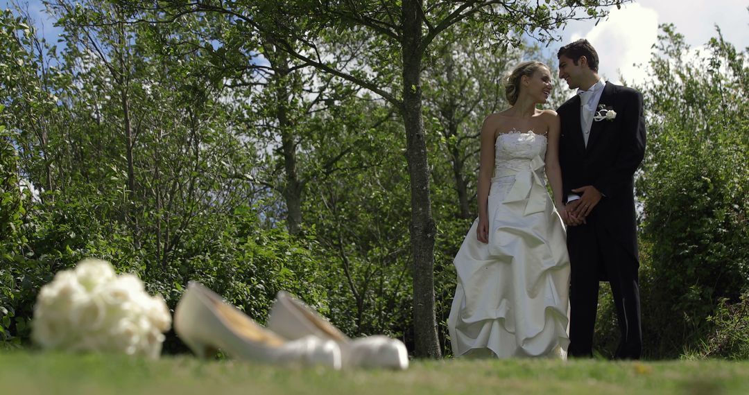 Bride and Groom in Outdoor Wedding Ceremony with Bridal Shoes and Bouquet - Free Images, Stock Photos and Pictures on Pikwizard.com