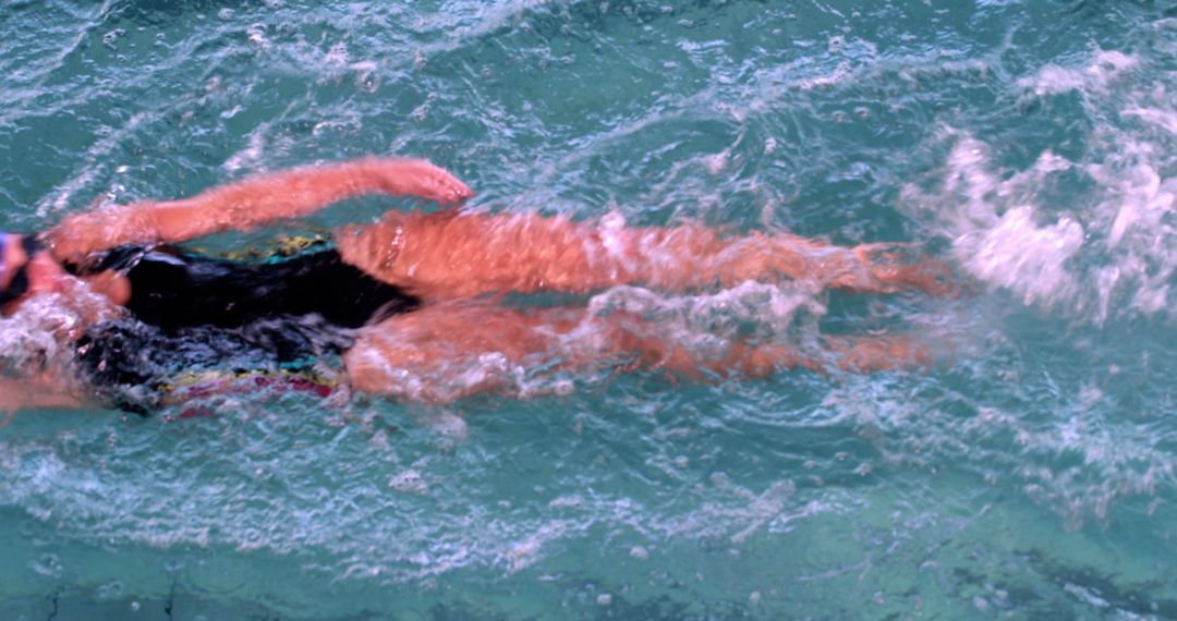 Top View Swimmer in Action in Blue Swimming Pool - Free Images, Stock Photos and Pictures on Pikwizard.com